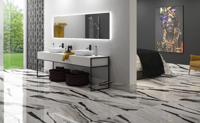 A Elizabeth lança a coleção Conexão Humana e um novo tipo de acabamento, o Porcelanato HD Polido Matte, na Expo Revestir 2019. O novo acabamento consiste em um polimento mate, realizado após o polimento tradicional, com o objetivo de retirar todo o brilho da peça e proporcionar um toque de seda ao produto. Dentre os destaques da nova coleção, está o Panda Porcelanato HD Polido (50x101cm), que exalta o clássico contraste do preto com o branco em um design contemporâneo. Versátil, o produto cabe com perfeição em ambientes modernos e retrô, em pisos, paredes ou bancadas. E o Oxi Porcelanato HD Polido e HD Polido Matte (84x84cm), que faz referência ao concreto e o metal, materiais presentes no meio urbano e em plena evidência nas paginações da arquitetura moderna. Os materiais com a aparência desgastada pelo tempo ganham espaço no design industrial e se revelam nos tons Black, Corten, Coffee, Gray e Bone. A possibilidade de ter produtos nos acabamentos HD Polido e HD Polido Matte nessa linha oferece diferentes oportunidades de composição personalizadas, com texturas brilhosas, foscas ou até intercaladas. A marca também lança o novo formato 101x101cm, o maior produzido pela empresa. Na foto, Panda Porcelanato HD Polido.